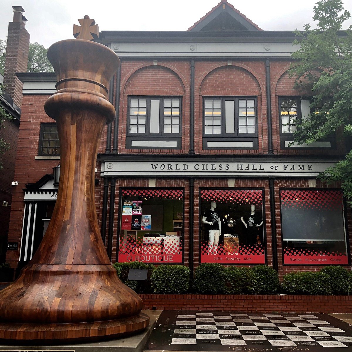 Sculptures and a giant chess set decorate a plaza as part of Louis
