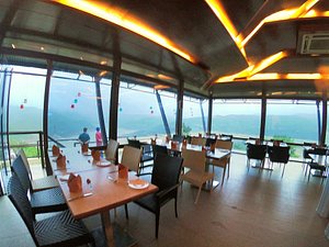 Ekaant The Retreat in Lavasa, image may contain: Dining Table, Dining Room, Restaurant, Resort