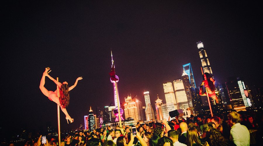 Acrobatic Pole Dancers on the rooftop terrace of Bar Rouge Shanghai