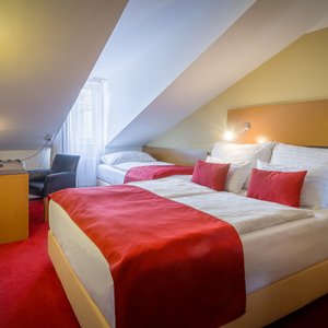 Theatrino Hotel in Prague, image may contain: Bed, Furniture, Chair, Lamp