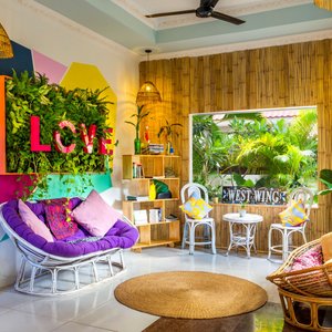 BE Happy Guesthouse sitting room and LOVE green wall