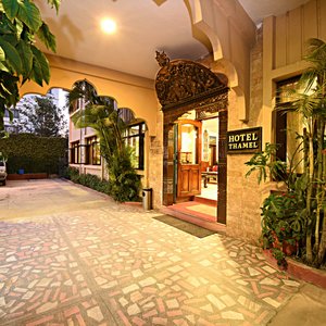 Hotel's entrance with a wood craving sculptures. Hotel is open 24 hours a day.