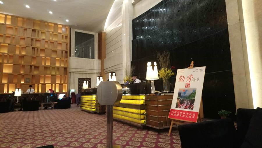 This is the lobby of the hotel where you can sit comfortably waiting for your business associates. The counter is there for the staff to assist you with your booking.