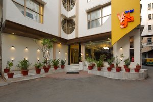 Hotel Volga in Ahmedabad, image may contain: Potted Plant, Hotel, City, Planter