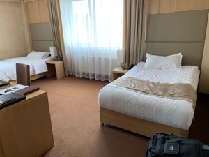 The Corporate Hotel in Ulaanbaatar, image may contain: Dorm Room, Furniture, Bed, Bedroom
