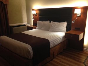 Cedar Meadows Resort & Spa in Timmins, image may contain: Furniture, Bed, Bedroom, Room