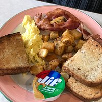bacon and eggs, with side of potatoes and rye toast