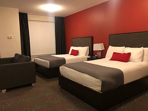 Liberty Suites Hotel in Thornhill, image may contain: Furniture, Bed, Bedroom, Room