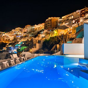 The view of Fira town at night from our infinity heated pool