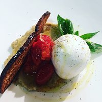 Mozzarella di Bufala Campana (from Naples Italy) w/ oven roast roma tomatos, charred eggplant cream and crostino.