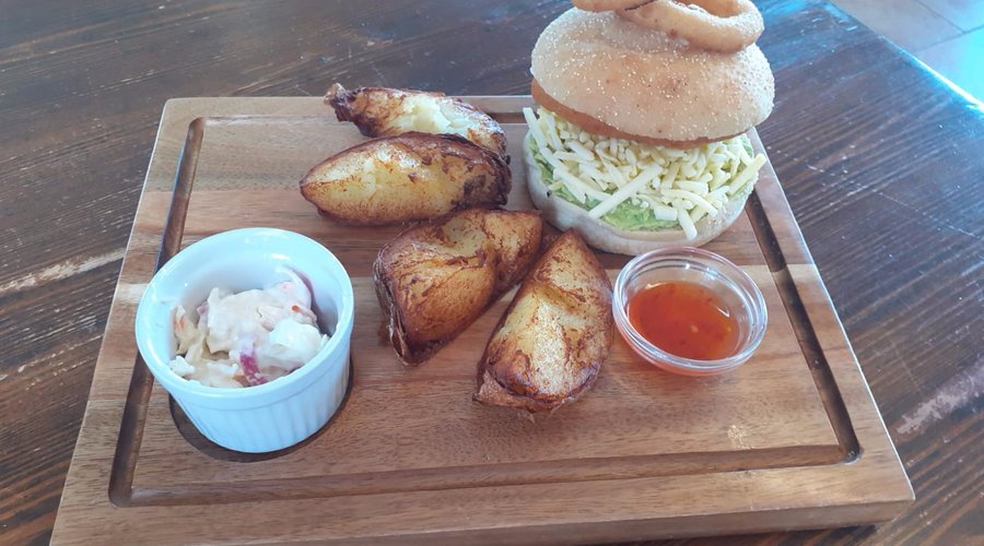 Chilli chicken burger with avocado and chunky wedges