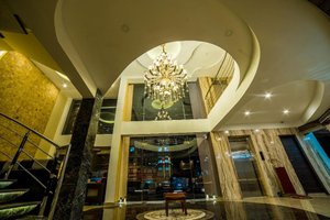Hotel President in Madurai, image may contain: Chandelier, Lamp, Lighting, Staircase