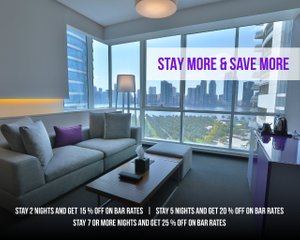 The Act Hotel in Sharjah, image may contain: Penthouse, Living Room, Couch, Table