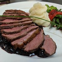 Duck breast in blueberry sauce.
