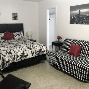 Green Seas Motel in Hollywood, image may contain: Furniture, Bed, Bedroom, Home Decor