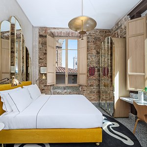 Hotel Calimala in Florence, image may contain: Interior Design, Indoors, Furniture, Chandelier