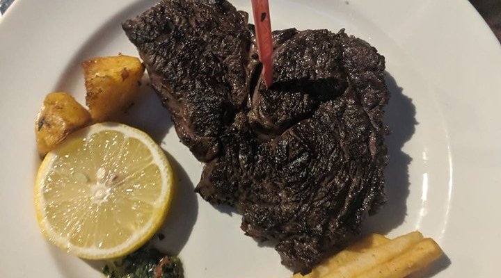 Argentinian Ribeye served with sides of roasted potato and chips ( in separate bowls)