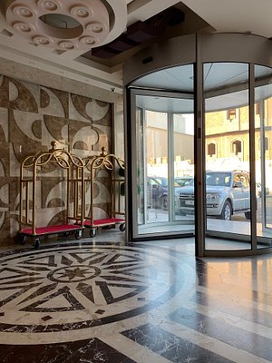 Royal Eagle Hotel & Restaurant in Najaf, image may contain: Door, Floor, Flooring, Car