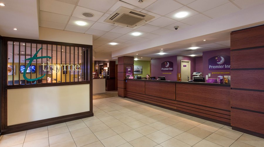 Premier Inn reception with check in desk and kiosks