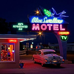 The classic neon sign welcomes travelers to the Blue Swallow Motel.  