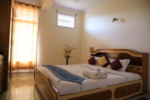 Hotel Sanawar View - Kasauli in Kasauli, image may contain: Bed, Furniture, Home Decor, Cushion