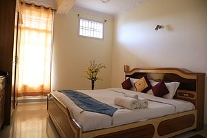 Hotel Sanawar View - Kasauli in Kasauli, image may contain: Bed, Furniture, Home Decor, Cushion