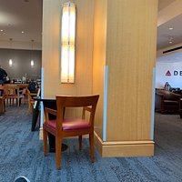 A nice place to spend time before flight. Breakfast food looked good. Blueberry muffin was tasty. They had a full bar if you wanted to drink at 10 am, I had a Diet Coke. Staff very friendly and helpful. I believe all the sky rooms are about the same. To get in I used my Amex platinum card. No maximum time you could be in there which was nice.