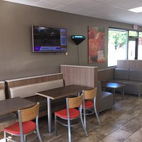 Looking at cash register and menu display.