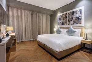 Summit Hotel Greenhills in Luzon, image may contain: Interior Design, Home Decor, Lamp, Bed