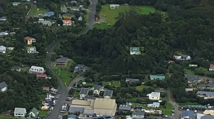 Aerial view looking down on Oban, South Sea Hotel, Halfmoon Bay School, Community Centre and Stewart Island Backpackers