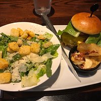 This is the $7.99 cheeseburger with a side caesar salad - little side of potato crisps with queso