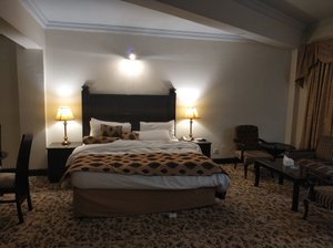 Hotel Hillview Islamabad in Islamabad, image may contain: Chair, Furniture, Home Decor, Bed
