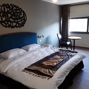 Layaali Amman Hotel in Amman, image may contain: Chair, Furniture, Bed, Interior Design