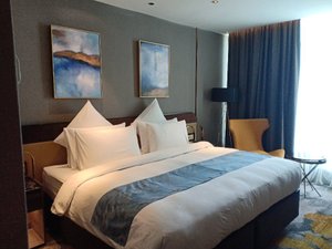 Ames Hotel in Melaka, image may contain: Bed, Furniture, Chair, Bedroom