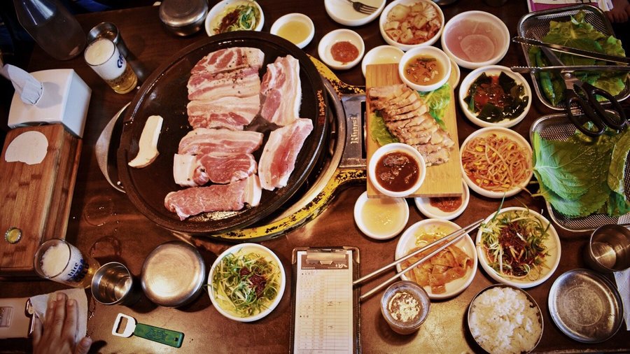 Have you ever seen a more mouthwatering set of pictures? 🤤 Today we are enjoying a famous traditional dish from Jeju Island, Black pork. 🐖 Thick cuts of juicy pork belly, cooked to a smokey crisp just how I love it. Alone the pork belly is enough to eat by itself and a side of rice. But we're not here to be basic, you either go big or go home, enjoy the side dishes that come with every meal.