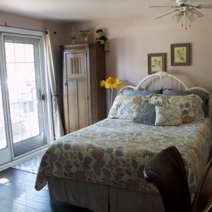 Delightful queen sized bed with patio access. Private bathroom.