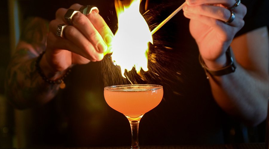 The smoking gun: one of several classic cocktails on Insomnia's extensive drink menu.  Ezra Brook's bourbon whiskey, Grand Marnier, tobacco fig syrup, chocolate bitters, flamed orange zest.  Served in a coupe glass.