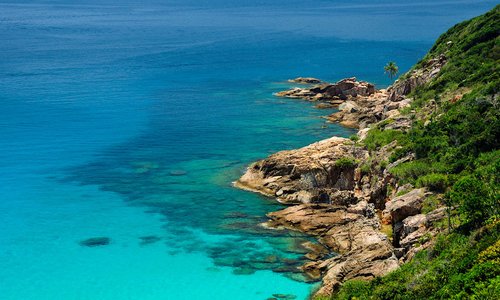 Zoom-in on the southern cape of the bay. Windmill Hike, Perhentian Kecil Island, Terengganu, Malaysia.
