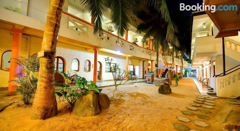 View of the hotel at night from the beach side.