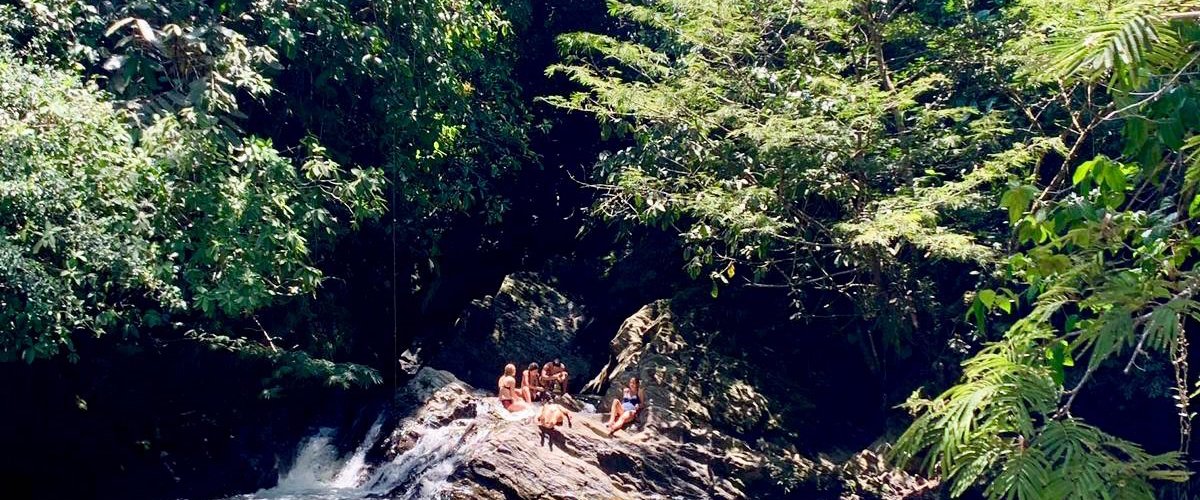 Swimming at a hidden waterfall.