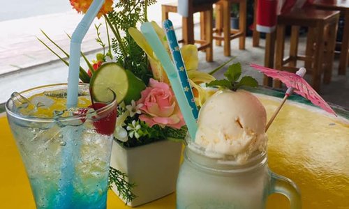 vanilla shake with vanilla ice cream and blue lemon Italian soda