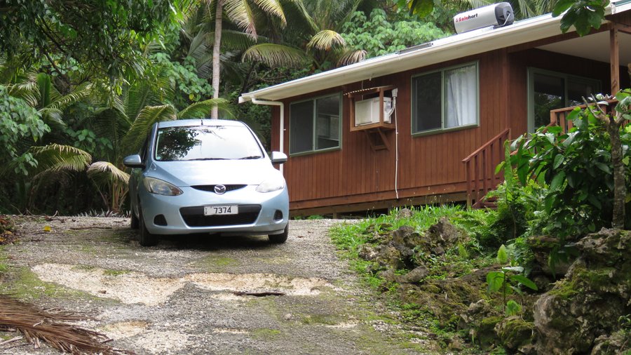 Our rental car (which came with the bungalow) parked outside, about to negotiate the inevitable potholes.