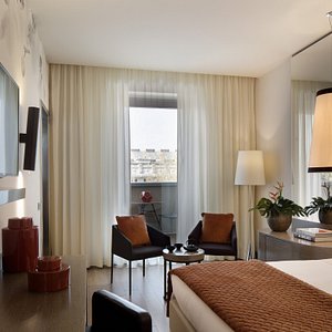 Starhotels E.c.ho. in Milan, image may contain: Living Room, Lamp, Chair, Bed