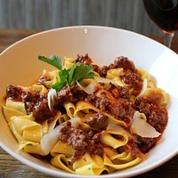 Our pappardelle bolognese has red wine-braised beef & pork, red sauce, parmesan and pecorino cream. It's delicious comfort food.