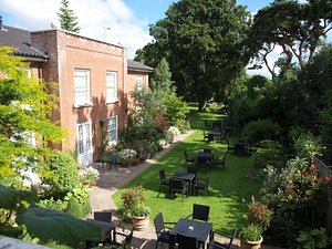 Beechwood Hotel in North Walsham, image may contain: Backyard, Grass, Garden, Chair
