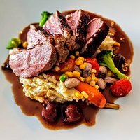 Roasted Breast of Duck: Caramelized Onion & Sour Cream Whipped Potatoes, Baby Carrots, Cherry Cinnamon Jus