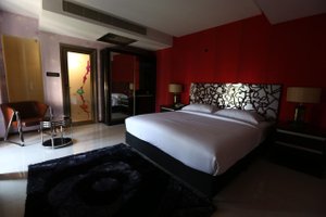 Hotel Million Day in Mayiladuthurai, image may contain: Bed, Furniture, Bedroom, Chair