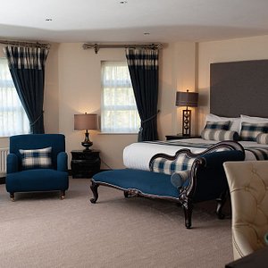 The Ambassador Suite has large Super King-size bed, large studio style living area and Jacuzzi b
