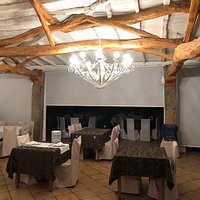 Sharp but rustic atmosphere with natural wood beams.