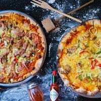 Our Meat lover pizza on the left and our Fruti del mare pizza (seafood) on the right